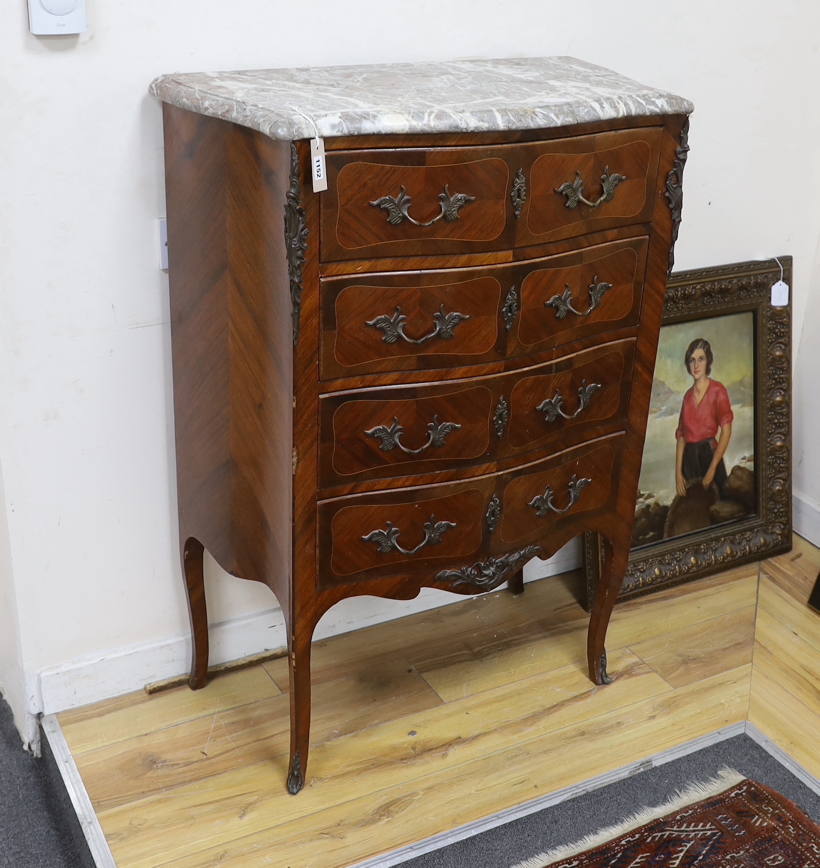 A Louis XVI style marble topped serpentine kingwood four drawer chest, width 82cm, depth 44cm, height 115cm